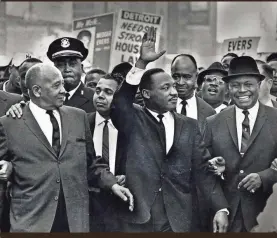  ?? TONY SPINA/USA TODAY NETWORK ?? Martin Luther King Jr. leads the 125,000-strong Walk to Freedom in Detroit in 1963, when African Americans who worked in the auto industry were relegated to jobs at the lower end of the spectrum.