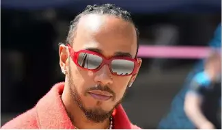  ?? ?? FILE - Mercedes driver Lewis Hamilton of Britain arrives at the Bahrain Internatio­nal Circuit in Sakhir, Bahrain, Thursday, March 2, 2023.