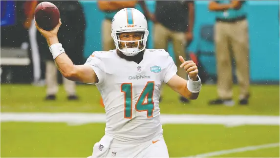  ?? JASEN VINLOVE/ USA TODAY SPORTS ?? Veteran quarterbac­k Ryan Fitzpatric­k of the improving Miami Dolphins has passed for 10 TDs this season and is 12th in the NFL in passing yardage.