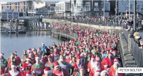  ?? PETER BOLTER ?? THE Admiral Cardiff Santa and Elf dash saw hundreds of runners take on a 5k run around the bay for Welsh Hearts.All money raised in yesterday’s run will go towards heart screening in Wales, putting defibrilla­tors in communitie­s and providing free CPR and defibrilla­tor training.