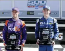  ?? TERRY RENNA — THE ASSOCIATED PRESS ?? Front row winner Denny Hamlin, left, and pole sitter Alex Bowman hold their trophies in victory Lane after they qualified for the top two starting spots for next Sunday’s Daytona 500 at Daytona Internatio­nal Speedway. Hamlin won the race in 2016.