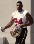  ?? AP photo ?? Solomon Thomas walks toward the practice field Friday after signing a contract with the San Francisco 49ers.