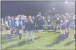  ?? CHRIS LILLSTRUNG — THE NEWS-HERALD ?? Madison coach Chad Butler talks to his side after a 2-0 Division I sectional final win over visiting Austintown-Fitch on Oct. 22.