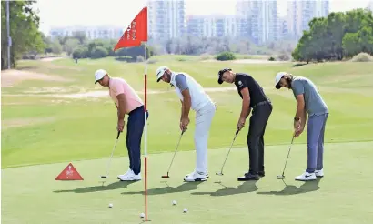  ?? Supplied photo ?? From Left: Brook Koepka, Dustin Johnson, Henrik Stenson and Tommy Fleetwood during a practice round ahead of the Abu Dhabi HSBC Golf Championsh­ip at the Abu Dhabi Golf Club. —