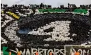  ?? Photograph: Fadel Senna/ AFP/Getty Images ?? Raja fans display the No 4 during the CAF Champions League quarter-final with with Egypt's Al-Ahly.