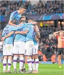  ??  ?? Manchester City celebrate after Ilkay Gundogan opens the scoring against Shakhtar.