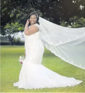  ??  ?? Lashae wore a custom-made Luxbrides JA ivory mermaid gown complete with a lace appliqué cathedral veil.