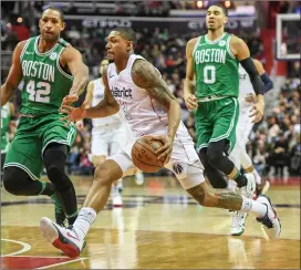  ?? File photo ?? Even though Al Horford (42) left for Philadelph­ia, Jayson Tatum (0) and the Celtics believe they are contenders after adding point guard Kemba Walker.
still