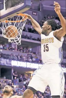  ?? Getty Images ?? FRESH START: Kenneth Faried, dunking with the Nuggets, says his new Nets gig is like being a rookie again.