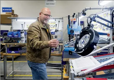  ?? NWA Democrat-Gazette/BEN GOFF ?? Greg Cornett, director of manufactur­ing for Walther, describes the first steps in assembly and testing of a PPK pistol at the Walther Arms site in Fort Smith.