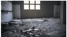  ??  ?? GONE. What is left of a bathroom of the dilapidate­d stadium in Bronkhorst­spruit, with missing windows and doors.