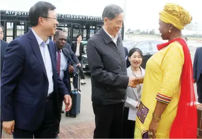  ?? — Picture: Edward Zvemisha ?? Zanu PF National Chairperso­n Cde Oppah Muchinguri-Kashiri (right) welcomes the Vice Chairman of the 14th National Committee of the Chinese Political Consultati­ve Conference, Cde Jiang Xinzhi (second from right) while Chinese Ambassador to Zimbabwe Mr Zhou Ding (left) looks on at the Robert Gabriel Mugabe Internatio­nal Airport in Harare yesterday.