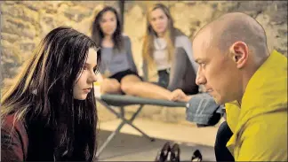  ??  ?? Casey (Anya Taylor-Joy, far left) faces off against Kevin (James McAvoy), who’s kidnapped and imprisoned her and her friends (Jessica Sula, center left, Haley Lu Richardson).