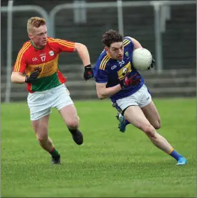  ??  ?? Conor Byrne of Wicklow is chased by Liam Roberts of Carlow during their O’Byrne Cup game at Netwatch Cullen Park.