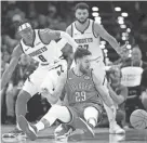  ?? SARAH PHIPPS/THE OKLAHOMAN ?? Oklahoma City guard Vasilije Micic (29) loses the ball as Denver forward Peyton Watson (8) defends on Oct. 29.