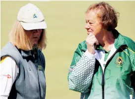  ??  ?? Above: Considerin­g the state of the game are Garfield’s Maureen Lamport (left) and Jan Johnson at Drouin.