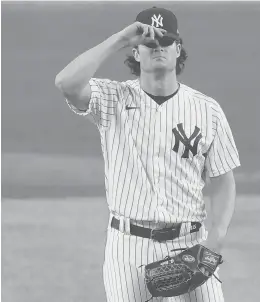  ?? KATHY WILLENS/AP ?? Yankees starting pitcher Gerrit Cole reacts after allowing a two-run homer to the Rays’Ji-Man Choi during the first inning Monday at Yankee Stadium in New York. Cole was the losing pitcher in the Yankees’ 5-3 defeat against Tampa Bay.
