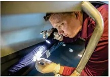  ?? RICARDO B. BRAZZIELL / AMERICAN-STATESMAN ?? Josh Robertson,with ABC Home &amp; Commercial Services pest control, inspects Austin Resource Center for the Homeless for bedbugs on Tuesday. Officials for ARCH say they will boost pest control efforts.