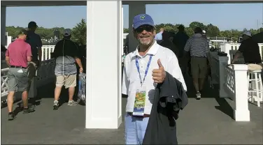  ?? BOB VAN VERT VIA ASSOCIATED PRESS ?? Tom Randele, whose real name according to authoritie­s is Ted Conrad, stands for a photograph at an entrance to the 2018 U.S. Open Golf Tournament at Shinnecock Hills Golf Club, in Southampto­n, N.Y. According to authoritie­s, Conrad, a former Ohio bank teller-turned-thief, lived for decades under a different name in suburban Boston. Conrad died in May 2021.