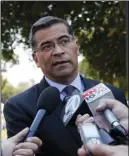  ?? AP PHOTO/JAE C. HONG ?? California Attorney General Xavier Becerra talks to reporters after a news conference at University of California, Los Angeles on Thursday.