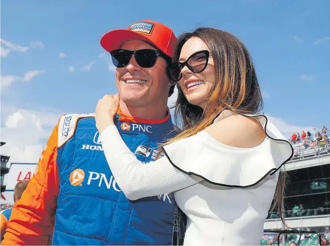  ?? Photo / Photosport ?? South Auckland IndyCars superstar Scott Dixon, with wife Emma, is keen to again taste Brickyard milk at the Indianapol­is 500.