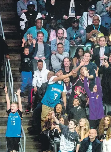  ?? Gina Ferazzi Los Angeles Times ?? THERE ARE JERSEYS from other teams but none from the Lakers or Clippers in this section of the stands during the slam dunk contest. Today’s game will have a different feel, with no local players competing.