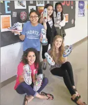  ?? Kristina Wilder / Rome News-Tribune ?? The artists and their shoes (from left, standing) Keilly Comix, Ryoko Goseki and Hyemin Yoo and (seated from left) Isabella Garrett Roberson and Lauren Moye.