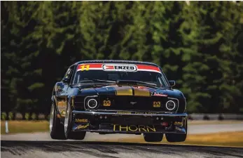  ?? Picture Tayler Burke ?? Angus Fogg and his mighty Boss Mustang defy gravity at Highlands Motorsport Park. He races this weekend at Hampton Downs.