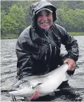  ??  ?? Bob White with his 19lb fish caught on the fly at Benchil.