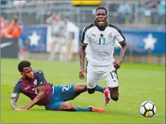  ?? JESSICA HILL/AP PHOTO ?? Ghana’s Lumor Agbenyenu is tripped by Kellyn Acosta of the United States, left, during the first half of an internatio­nal friendly on Saturday.