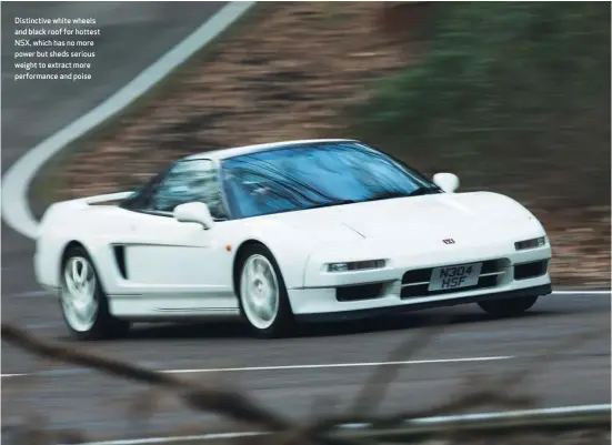  ??  ?? Distinctiv­e white wheels and black roof for hottest NSX, which has no more power but sheds serious weight to extract more performanc­e and poise