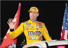  ?? TERRY RENNA/AP PHOTO ?? In this Feb. 13 file photo, Kyle Busch waves to fans during driver introducti­ons for the first of two Daytona 500 qualifying races at Daytona Internatio­nal Speedway in Daytona Beach, Fla.