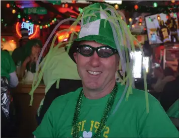  ?? ANNE RUNKLE — THE OAKLAND PRESS ?? Chris Dufresne of Clarkston celebrates St. Patrick’s Day at Kennedy’s Irish Pub in Waterford Township.