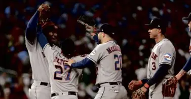  ?? BRUCE KLUCKHOHN/ASSOCIATED PRESS ?? The Astros celebrate Wednesday after securing a berth in a seventh straight ALCS.