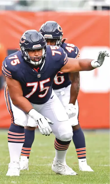  ?? AP ?? GM Ryan Pace said the Bears graded fifth-round pick Larry Borom (above) close to second-round pick Teven Jenkins.