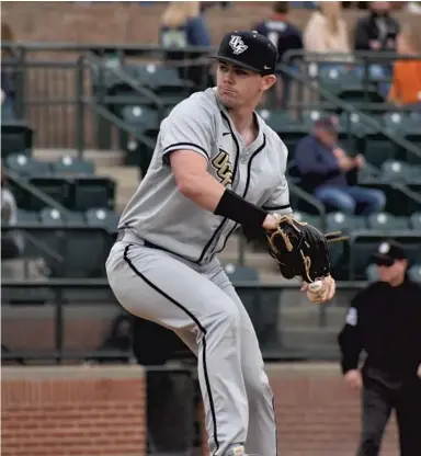  ?? COURTESY OF COLLIN YEAGER/UCF ATHLETICS ?? UCF pitcher Joe Sheridan winds up to deliver a throw during the Knights’ weekend series sweep of No. 8 Auburn.