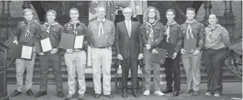  ??  ?? Six Venturers of the 1st Elmira Scouts received the top scouting award last month at Queen’s Park in Toronto. From left to right: Tyler Elg, Liam Hanley, Cameron McGee, Central Escarpment Council commission­er Dean Post, Chief Justice of Ontario George Strathy, Erik Zinke-Spencer, Max Campbell, Callum Knox, and Rover leader Monica Goddard standing in for Venturer leader Brian Soehner.