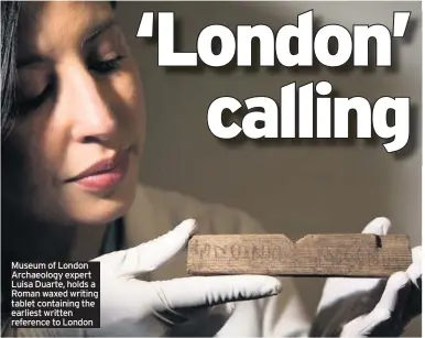 ??  ?? Museum of London Archaeolog­y expert Luisa Duarte, holds a Roman waxed writing tablet containing the earliest written reference to London