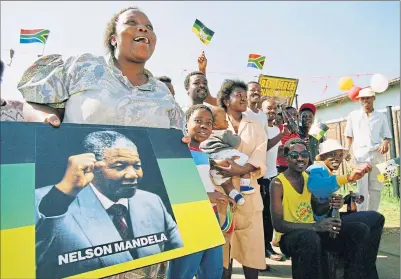  ??  ?? Voters in Soweto celebrate the election of Nelson Mandela on May 10, 1994