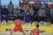  ?? JED JACOBSOHN — THE ASSOCIATED PRESS ?? The Golden State Warriors’ Stephen Curry, center, shoots a 3-pointer against Oklahoma City Thunder’s Isaiah Roby during the first half Saturday in San Francisco.