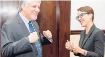  ??  ?? Can you feel the love? United States Ambassador to Jamaica Luis Moreno is about to bump fists with Minister of Foreign Affairs and Foreign Trade Kamina Johnson Smith.