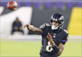  ?? Tim Nwachukwu / Getty Images ?? Quarterbac­k Lamar Jackson of the Baltimore Ravens throws a pass against the Dallas Cowboys during the third quarter on Monday night.