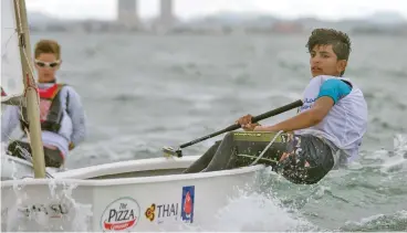  ??  ?? An Omani sailor competes at the ongoing Optimist World Championsh­ip in Pattaya, Thailand on Sunday