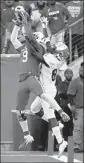  ?? Eric Christian Smith AP ?? NICK WATKINS of Houston intercepts a pass intended for South Florida’s Zion Roland.