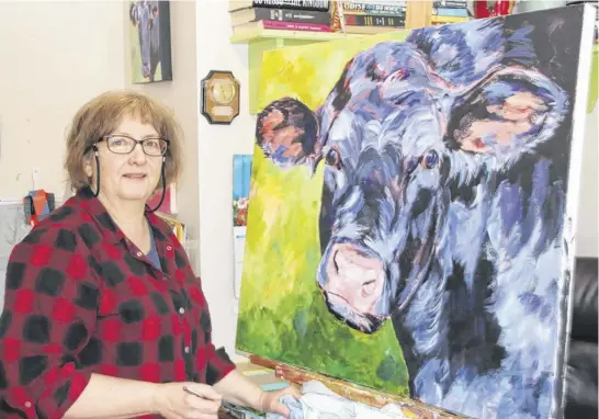  ?? LYNN CURWIN PHOTOS ?? Cattle are favourite subjects for Susan Sweet when it comes to painting. They appear in both large and small paintings as well as ornaments created by the Maitland resident.