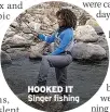  ?? ?? HOOKED IT Singer fishing