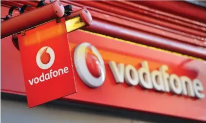  ?? ?? Vodafone is pressing ahead with cost-saving measures, including job cuts. Photograph: Ben Stansall/AFP/Getty Images