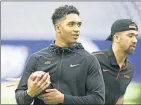  ?? [BRUCE WATERFIELD/COURTESY OSU ATHLETICS] ?? Hubbard, left, and quarterbac­k Spencer Sanders enjoy a casual walkthroug­h at NRG Stadium in Houston, site of Friday's Texas Bowl between OSU and Texas A&M.