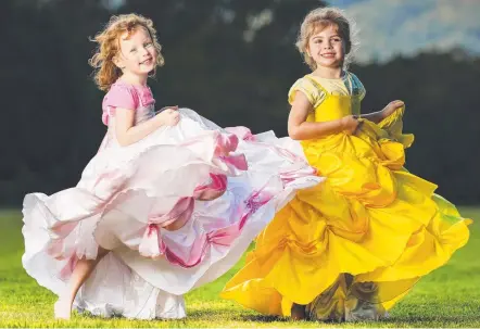  ?? Picture: NIGEL HALLETT ?? Grace Thomas and Ruby Fitzsimmon­s, both 4, from Mudgeeraba love to dress up as princesses.