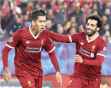  ?? Picture: REUTERS ?? RED-HOT FORM: Jurgen Klopp has a fearsome frontline consisting of Roberto Firmino and Mohamed Salah.